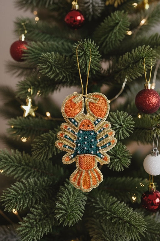 Lobster Ornament — A lobster-shaped Christmas ornament hanging on a decorated green Christmas tree with red ornaments and warm string lights. — Zohricanada