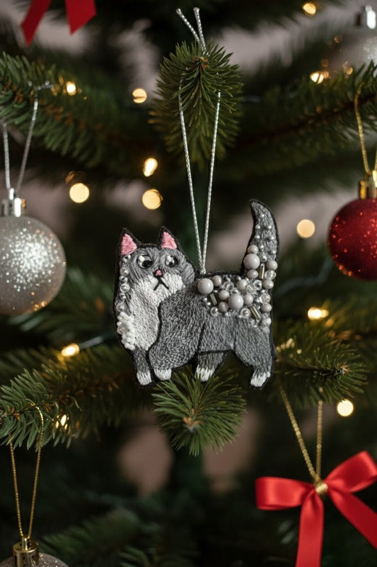Silver Beaded Cat Ornament — A gray and white cat Christmas ornament decorated with silver beads, hanging from a decorated Christmas tree with warm lights and other ornaments. — Zohricanada